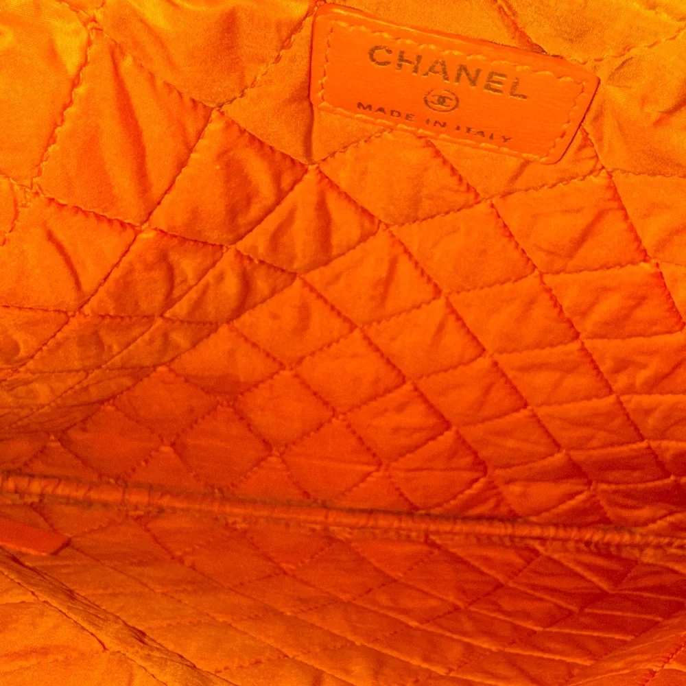 Chanel orange perforated quilted leather O case clutch pouch NWOT